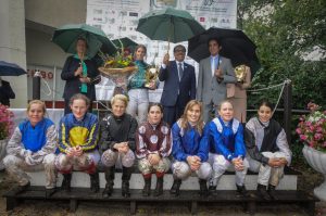 Lady jockey in the rain